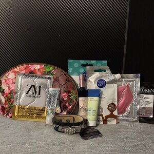 Floral Pink Makeup Bag with masks, lip balms, and bracelet